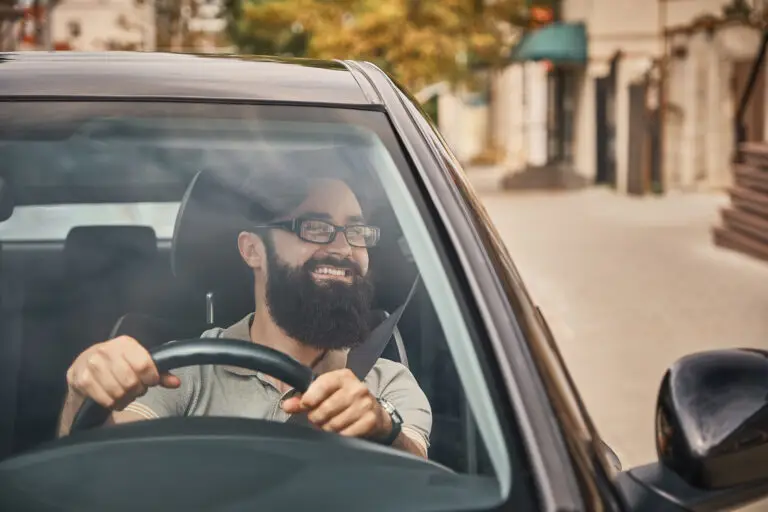 modern bearded man driving car
